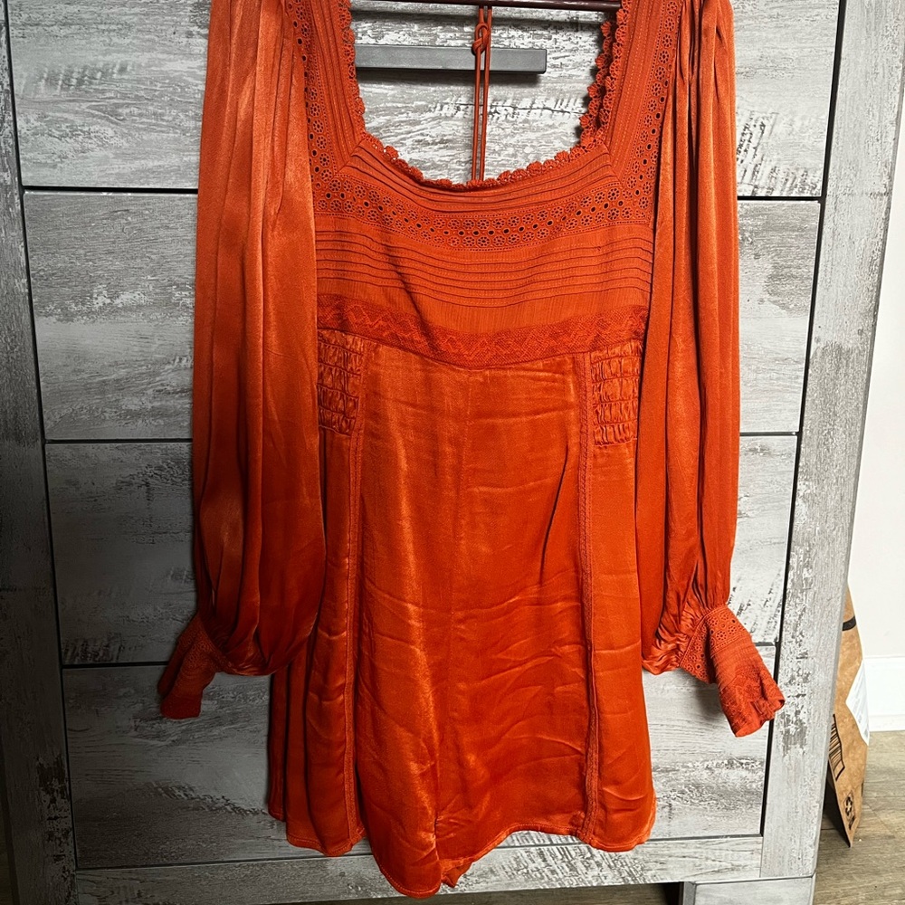 Free people romper in rusty orange color, size 8